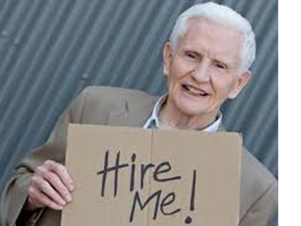 older worker holding "hire me" sign