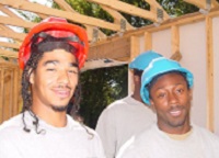 Two student workers in hardhats