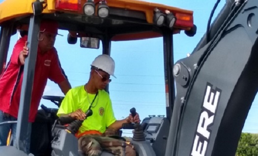 Young Man Operating Deere Vehicle