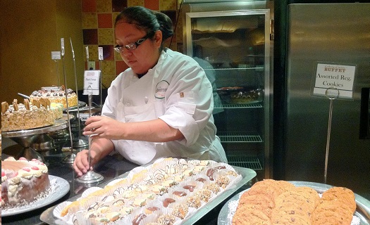 Chef putting pastries out
