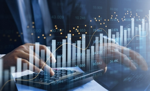 Bar graphs and other data superimposed over a person in business attire. 