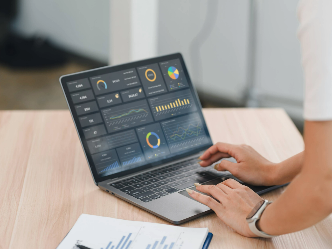 Person accessing data on a laptop.