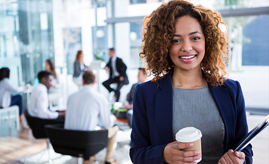 portrait-smiling-businesswoman-holding-coffee-office.png