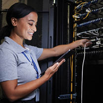 Server room, tablet and engineer woman with connection cable for maintenance or software update at night. Cybersecurity, it programmer or female with technology for database networking in data center.